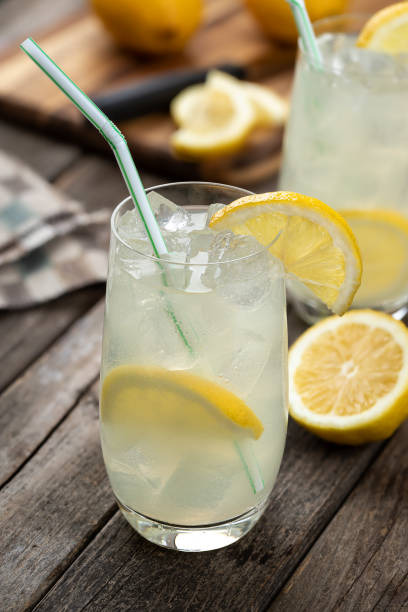 istock Glass of cold lemonade with lemon slices 1700324171