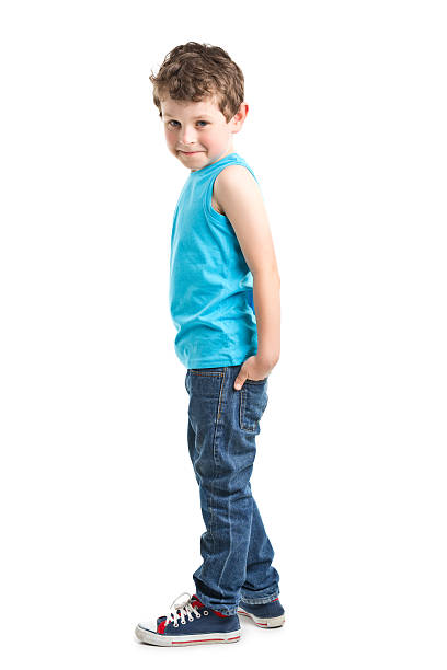 Studio shot of a cute little girl in casual wear posing against a white background