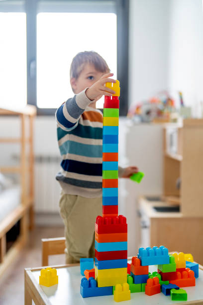 istock Happy child at home playing with removable parts 1700335926