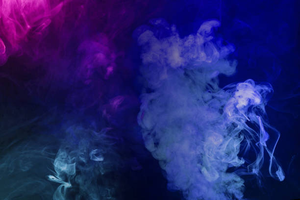 istock Green and pink steam on a black background. 1700345918