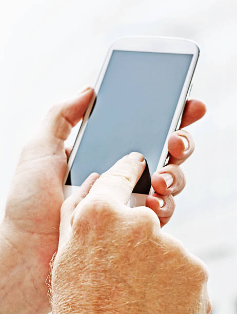 istock Masculine hands touching blank screen of smart phone 170034671