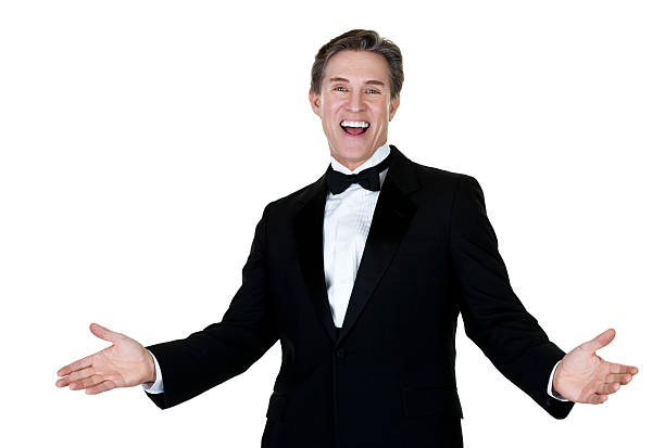 Excited man wearing a tuxedo Waist up composition of a mature man with an excited expression wearing a tuxedo and isolated on white background  tuxedo stock pictures, royalty-free photos & images