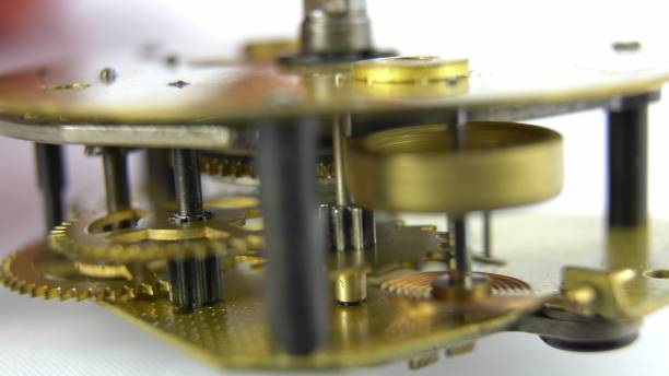 istock Clockwork Mechanism Of Retro Clock Rotating Cogwheels Gears Close Up 1700353634