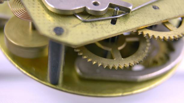 istock Clockwork Mechanism Of Retro Clock Rotating Cogwheels Gears Close Up 1700353639