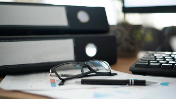istock Financial files and glasses on desk 1700357602
