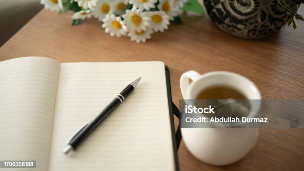 Diary And Herbal Tea Standing On The Table Stock Photo - Download Image Now - Bullet Journal, Concepts, Mindfulness