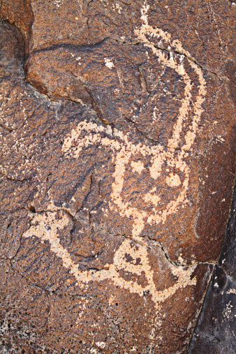 One of over 20,000 petroglyphs found in the Boca Negra Canyon area near Albuquerque, New Mexico. Archeologists estimate they were created between 1000 BC and 1700 AD. Many are the artwork of the Pueblo Indians who lived in the Rio Grande Valley of New Mexico, USA.