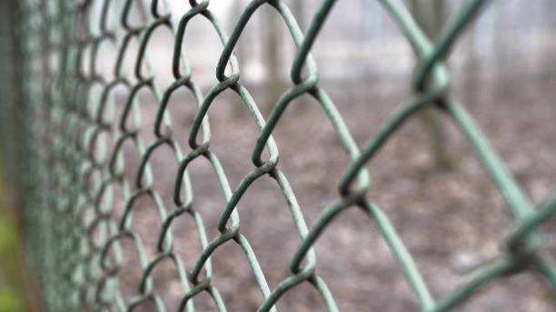 istock Rusted Fence Close-Up Shallow Focus 1700361917