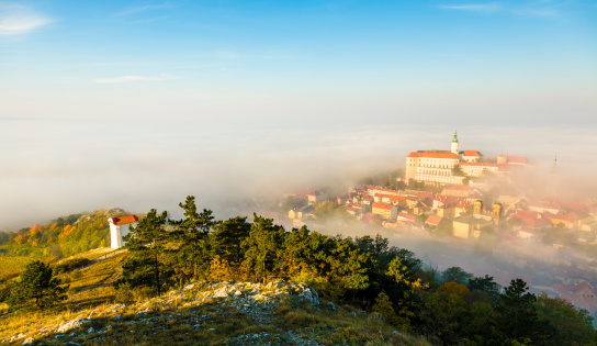 Mikulov covered with morning fog. View from Svaty Kopecek.