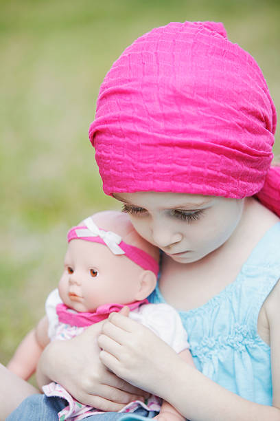 istock Shy Cancer Child with Doll 170036354