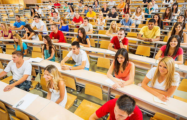 istock Large group of students at university amphitheatre. 170036773