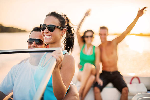 istock Cheerful couples enjoying on a speedboat ride. 170036779