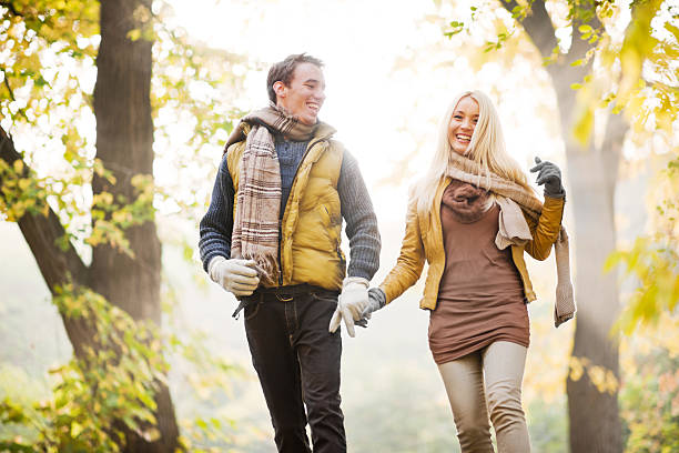 istock Beautiful smiling couple walking in the park. 170037259