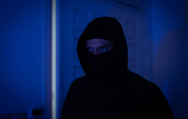 istock Thief breaks into the apartment through the front door. 1700376333
