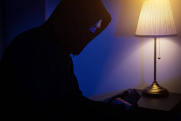 istock Thief steals money from the bedside table. 1700376426