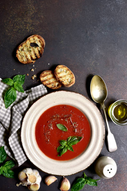 istock Spicy tomato soup or gazpacho. Top view with copy space. 1700377544