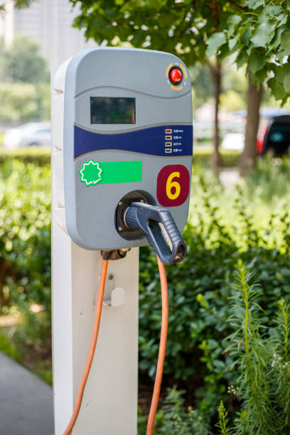 istock Electric car charging station. Electric Plug 1700382471