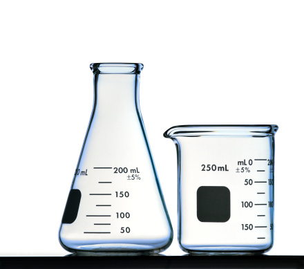 A Back Lit Image of an Erlenmeyer Flask and a Beaker Isolated on White with Clipping Path.