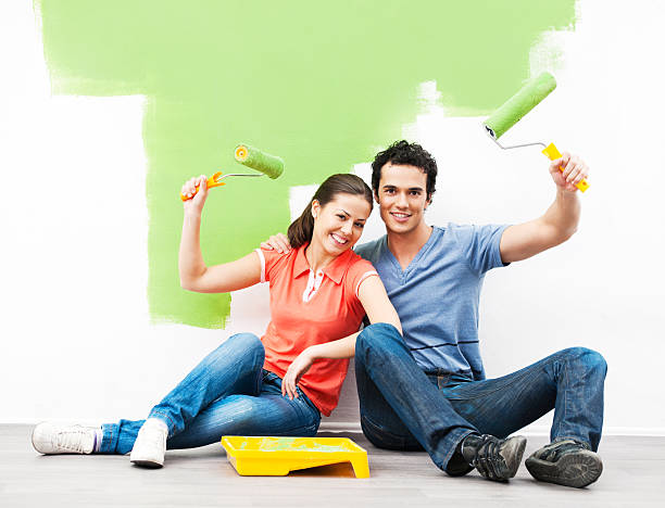istock Cheerful couple painting the wall. 170039543