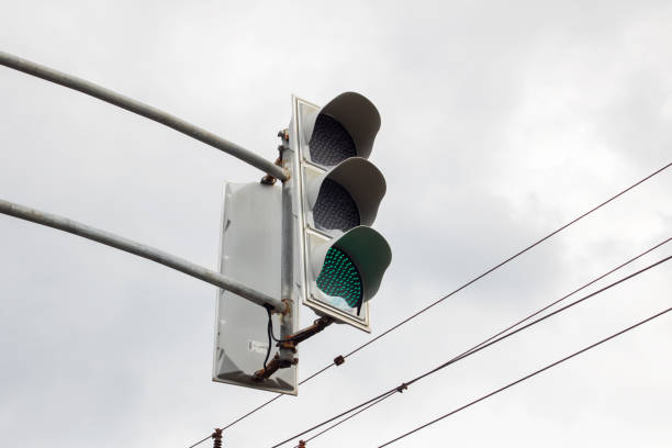 istock The traffic light in gray sky closeup 1700403984