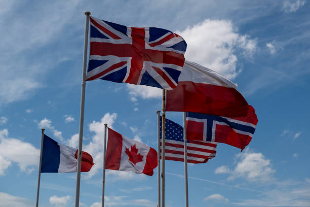 istock Many different flags fluttering in the wind against the sky. Great Britain Canada England France 1700412177