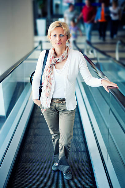 istock Woman On Escaltor 170041523