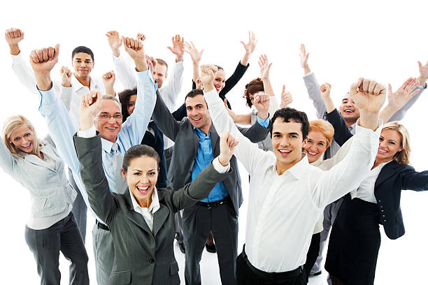 Successful Business People with raised hands. Group of a happy Business People standing together with raised hands and looking at the camera. sales win stock pictures, royalty-free photos & images