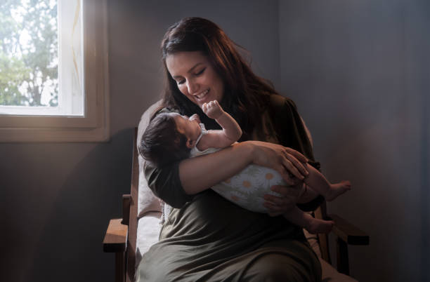 istock Newborn baby in mother's hands 1700417232