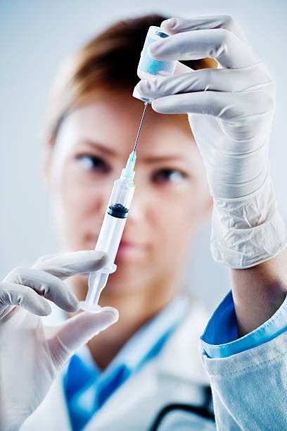 istock Female doctor preparing syringe. 170041893