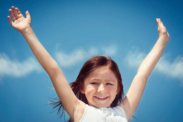 istock Little girl with arms raised 170042527