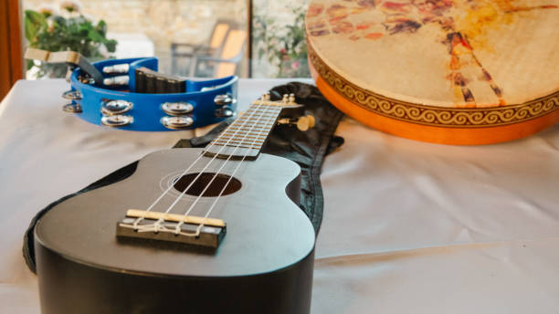 istock Guitar, tambourine and bendir placed on a table 1700437285