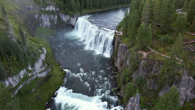 Drone Aerial of the Upper Mesa Falls, a thunderous curtain of water – as tall as a 10-story building  Near Island Park, and Ashton,  Idaho