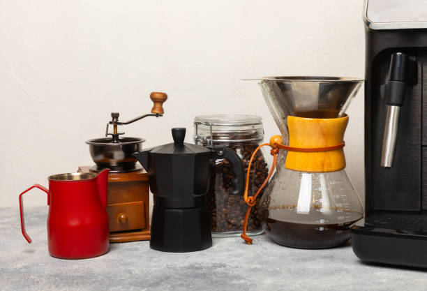istock Modern coffee machine with a cup on the kitchen table. Coffee house. Modern espresso coffee machine with a cup in the kitchen. Preparation of a fragrant hot drink. Place for text.Copy space. 1700448665