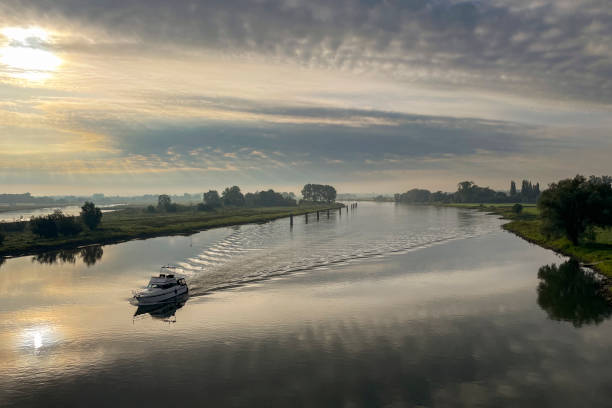 istock IJssel sunrise panoramic landscape view 1700454755