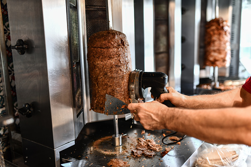 Automatic Cutting Tool Used By Doner Chef In Restaurant