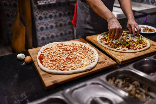 istock Different Types Of Pizza Prepared By Chef In Modern Pizza Restaurant 1700457084