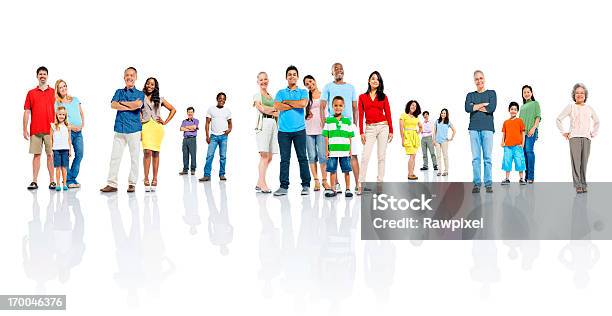 Men Women And Children All Standing In Different Groups Stock Photo - Download Image Now