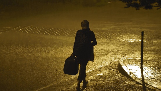 Lonely Person Walking in Heavy Rain with Lightnings at Night