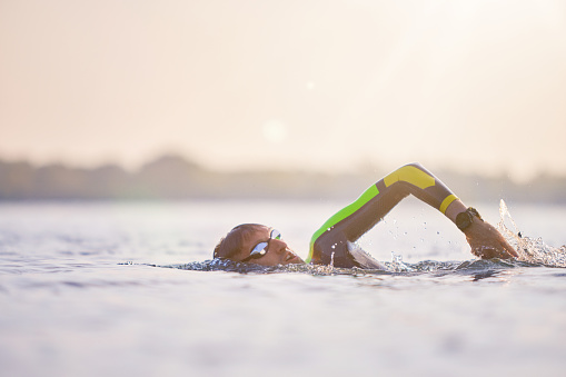 Competitors fighting in the swim event of a triathlon competition.