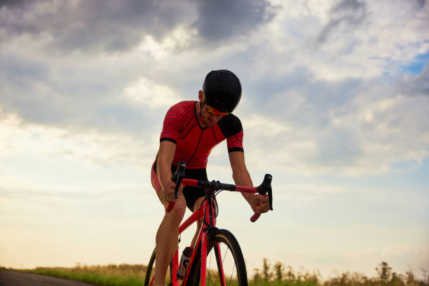 istock Endurance and motivation. Man, triathlete training, riding bicycle outdoors, preparing for marathon 1700469167