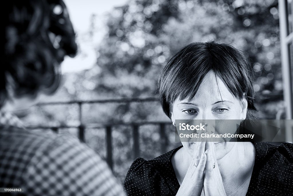 Anxious Young Woman In a Counselling Session. Female counsellor talking to a vulnerable client. Toned black and white. Interview - Event Stock Photo