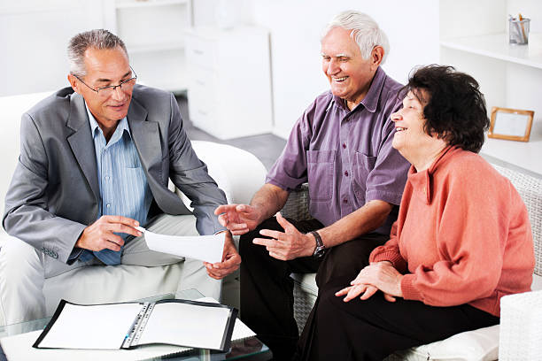 istock Senior couple meeting with financial advisor. 170047021