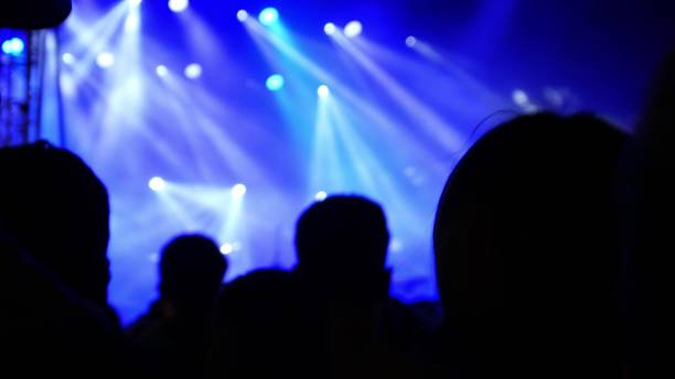 istock Anonymous Crowd Dancing in Music Club 1700472070