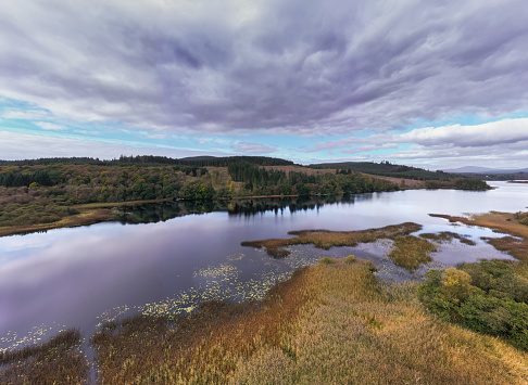 defaultAerial view from a drone of a loch in a remote rural location Scotland on an Autumn morning
