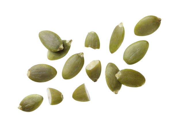 istock Pumpkin seeds flying on a white background. Isolated 1700480934
