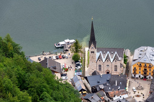 Hallstatt, Austria, July 9, 2022: Aerial view of the Lutheran Church in this village in Upper Austria. Hallstatt is listed as UNESCO World Heritage Site.