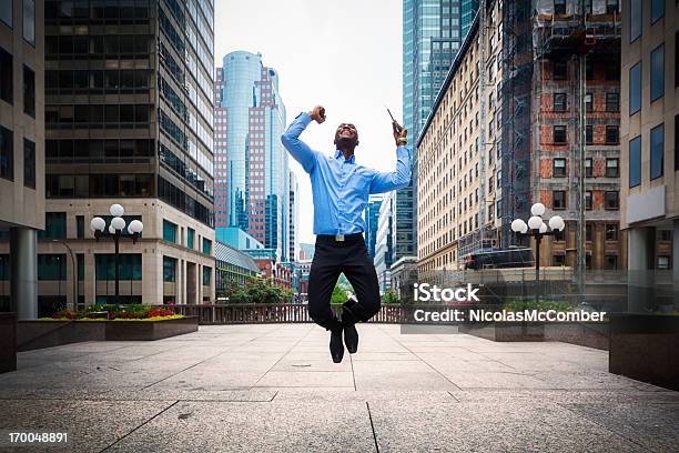 Successful Businessman Jumps With Joy Downtown Montreal Stock Photo - Download Image Now