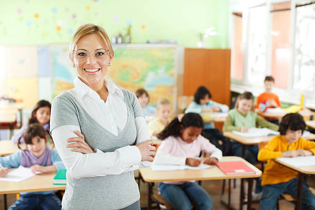 istock Smiling teacher at the school class 170049222