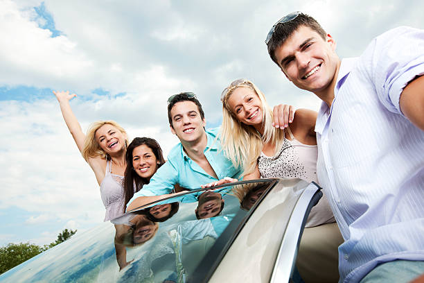 istock Group of young people and a cabriolet car 170049234
