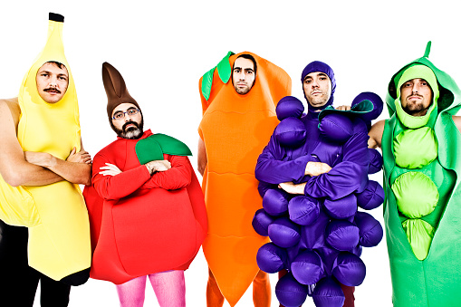 Five men dressed up like vegetable
